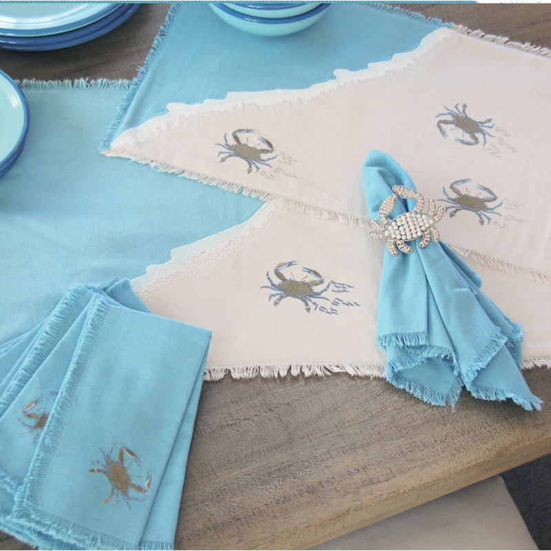 Ensemble de quatre serviettes en crabe bleu brodées