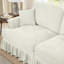 Canapé trois places de style années 50 avec accoudoirs évasés, jupe à volants amovible et plissée, tissu chenille beige et blanc, confortable, modulable et détachable.