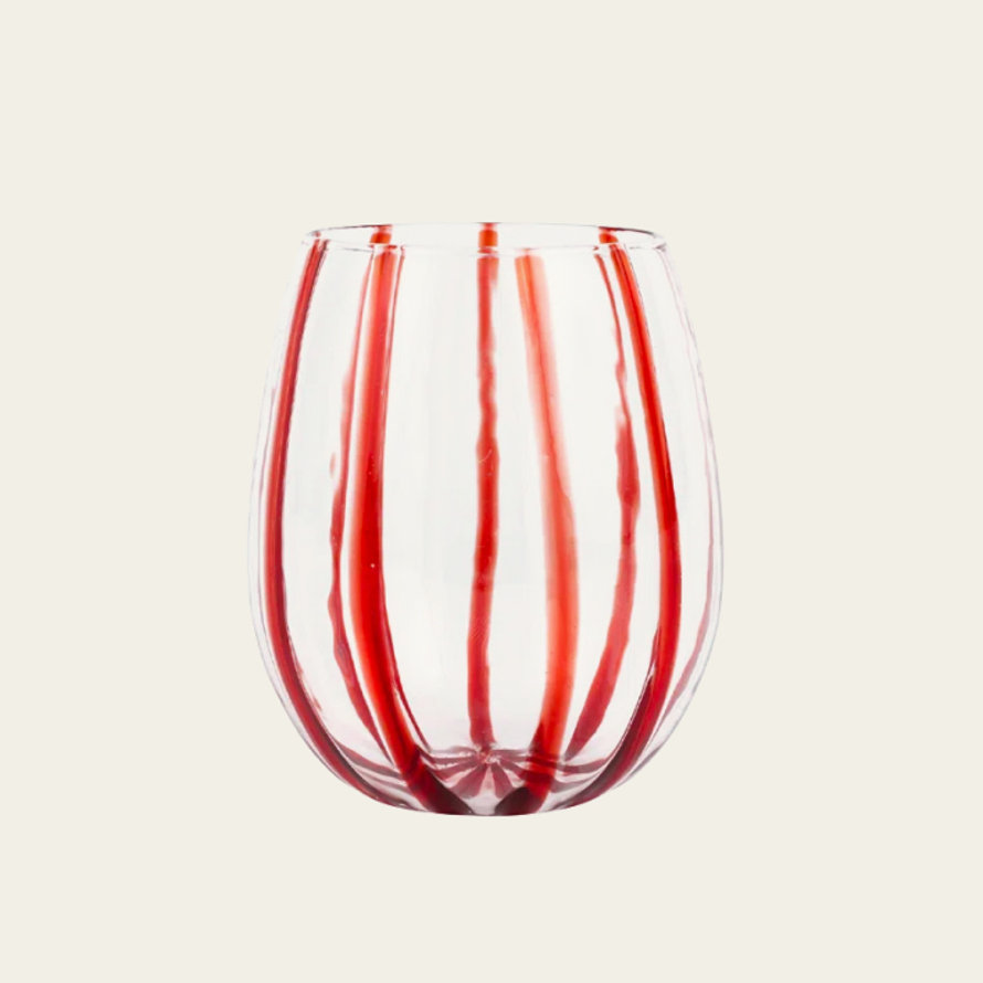 Clear stemless wine glass featuring vertical red stripes against a plain background.