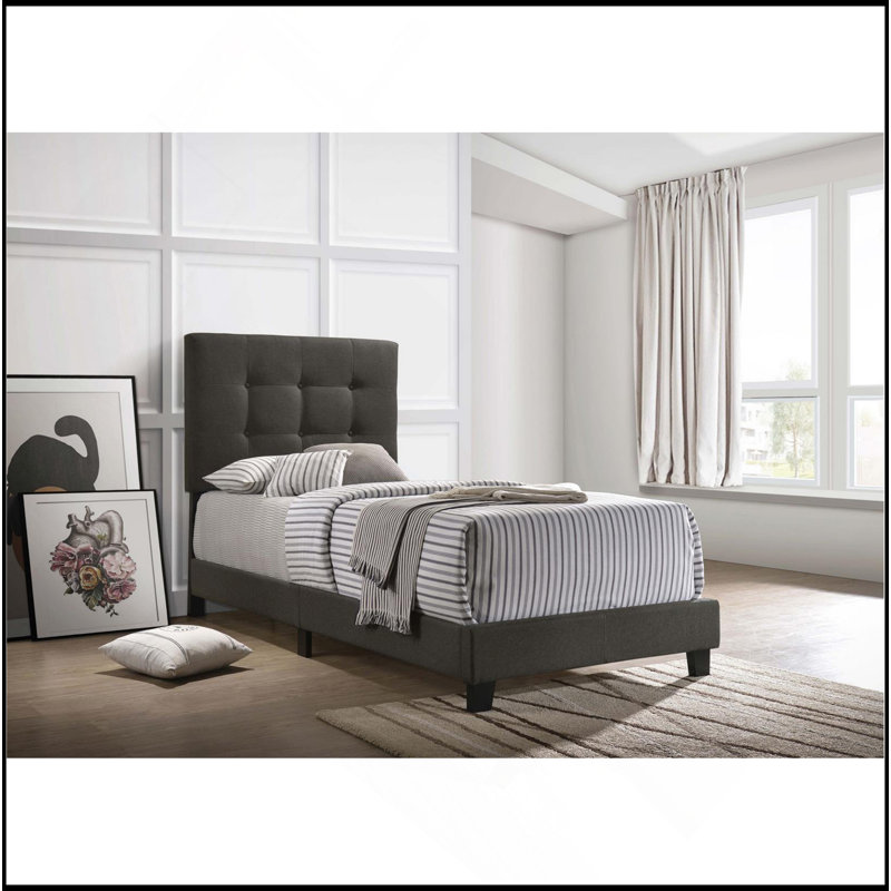 Lit à panneaux capitonné gris anthracite avec plateforme basse, parfait pour un décor de chambre à coucher moderne et sophistiqué