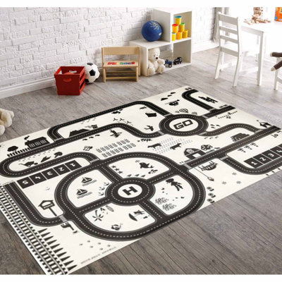 Tapis noir / ivoire en polyester tissé à la machine Tassone