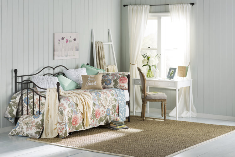 white shiplap behind daybed