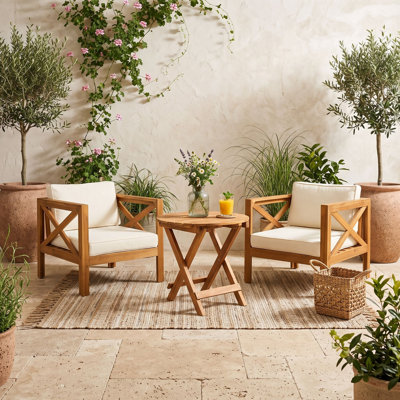 Ensemble de conversation en bois avec fauteuil et coussins