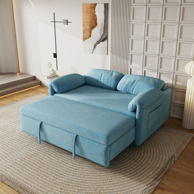 Présentation du canapé: canapé-lit en velours bleu - un bijou de salon à double usage avec option de lit escamotable