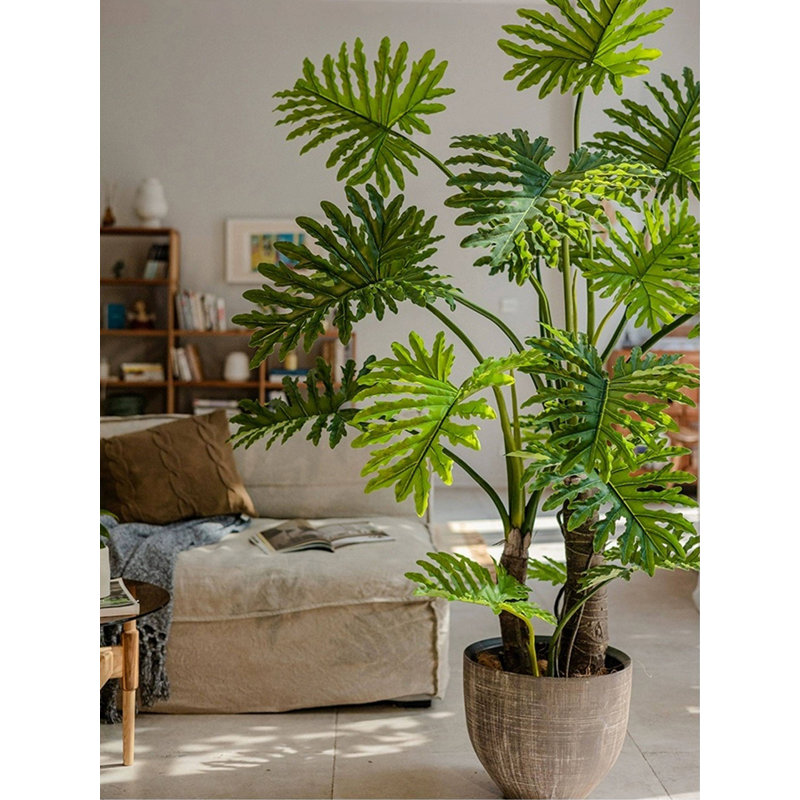 Plante artificielle verte en plumes printanières en pot