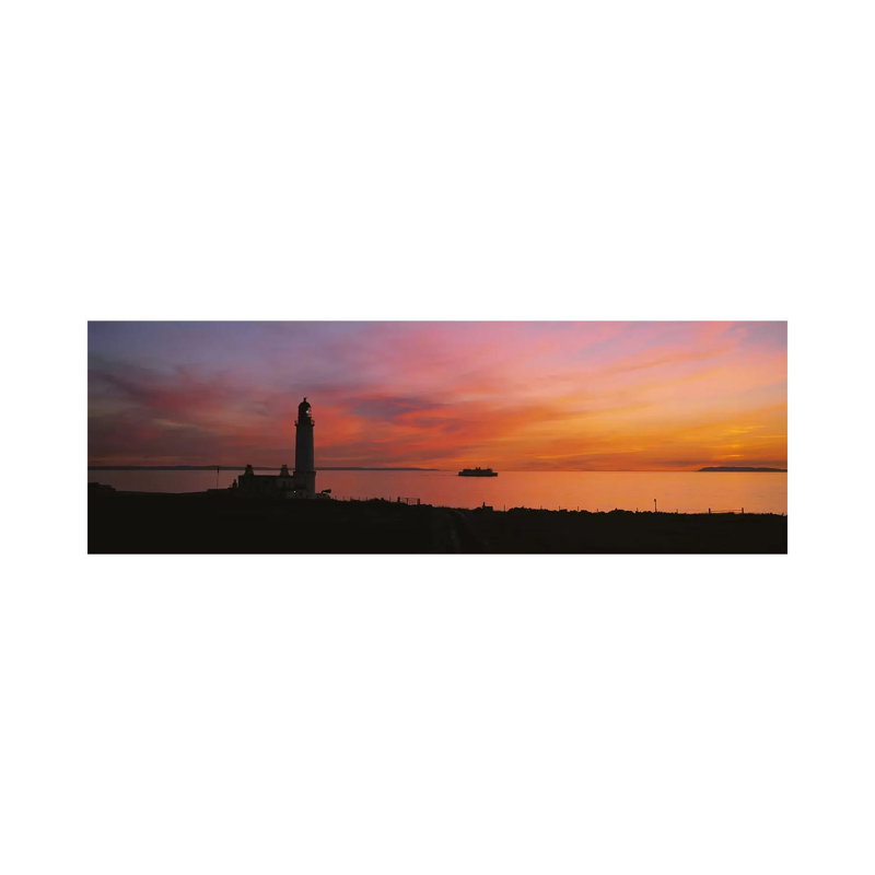 Silhouette Of A Lighthouse At Sunset, Scotland by Panoramic Images - Wrapped Canvas Panoramic Print
