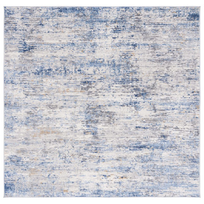 Tapis abstrait ivoire / bleu Adalee