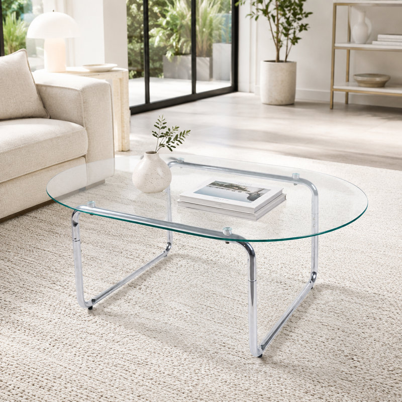 Table basse moderne ovale en verre trempé avec base incurvée en métal chromé