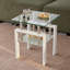 Élégante table basse en bois avec rangement dissimulé et surface durable, parfaite pour les salons modernes et les petits espaces.