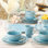 Service de table en grès 16 pièces Coastline Blue, service pour 4 avec coquillages côtiers en relief et étoile de mer, vaisselle bleu marine durable pour une vie côtière détendue, repas quotidiens et repas maison de plage