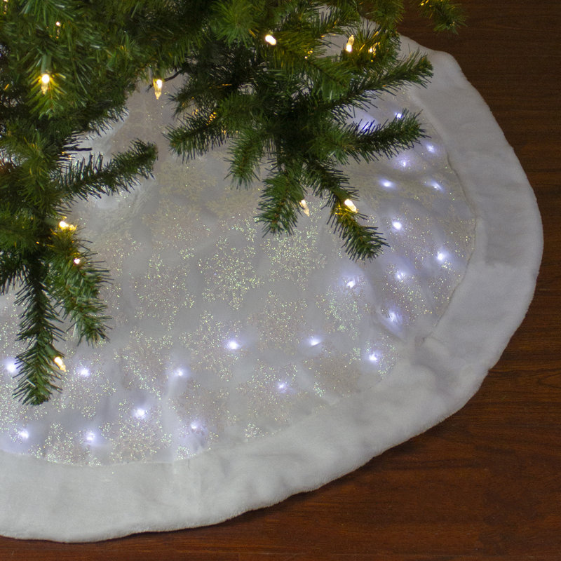Jupe d’arbre de Noël en forme de flocon de neige iridescent blanche à DEL 48 "avec garniture en fausse fourrure