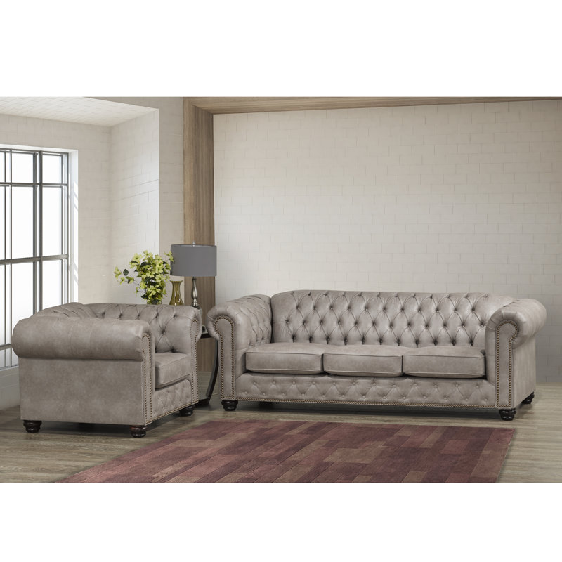 Canapé et fauteuil capitonné gris clair en similicuir Anim
