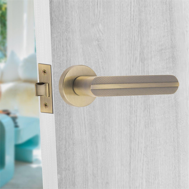 1 Pair Modern Lima Knurled Design Premium Door Handles on Round Rose in Antique Brass