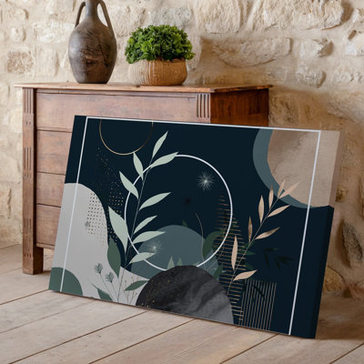 La toile crée une composition abstraite visuellement frappante avec des éléments botaniques délicats tels que des feuilles élancées et de l'art mural sur toile souple