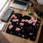 Motif de branches noires et roses