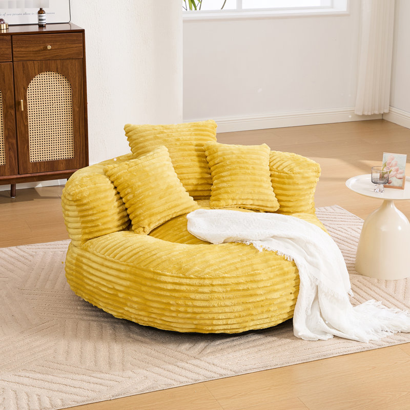 Grand pouf en velours côtelé avec rembourrage en mousse haute densité, idéal pour se détendre pendant les jeux vidéo et pour s'intégrer parfaitement dans les espaces de décoration modernes.