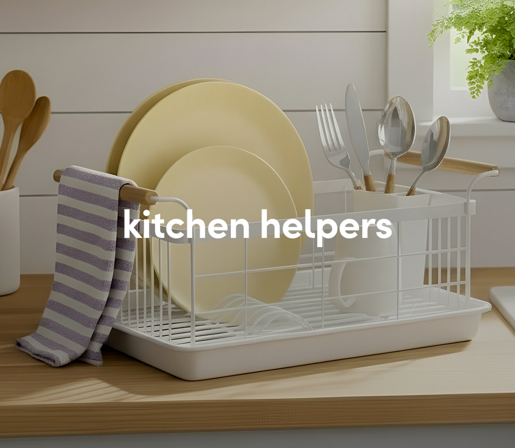 A white dish drying rack with clean white plates and a glass, displayed on a kitchen counter.