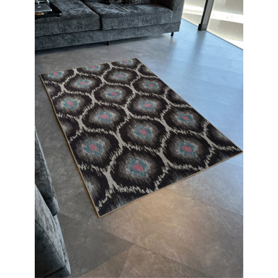 Tapis décoratif moderne à motif géométrique vibrant noir et gris