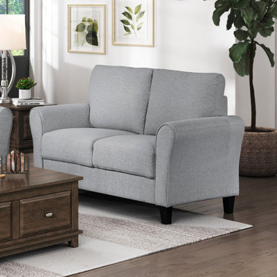 Causeuse moderne en tissu texturé gris foncé avec accoudoirs arrondis et coussins attachés
