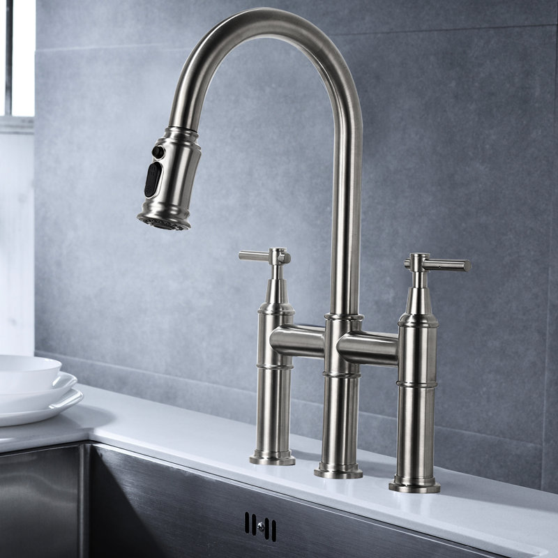 Bridge Kitchen Faucet With Brushed Nickel Finish. Pull-Down And Dual Handle For Convenient Usage. 360-Degree Rotating High Nozzle More Sink Space. Made Of Brass. Silent Splash- Water Flow Enhancer.