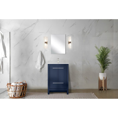 24 po L 20 po x P 2 po. Meuble-lavabo bleu marine avec surface en marbre de culture, robinet en nickel brossé et miroir de 18 po