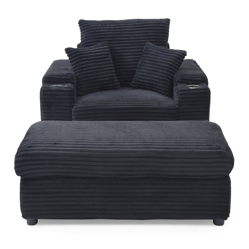 Fauteuil noir surdimensionné avec fauteuil d'appoint