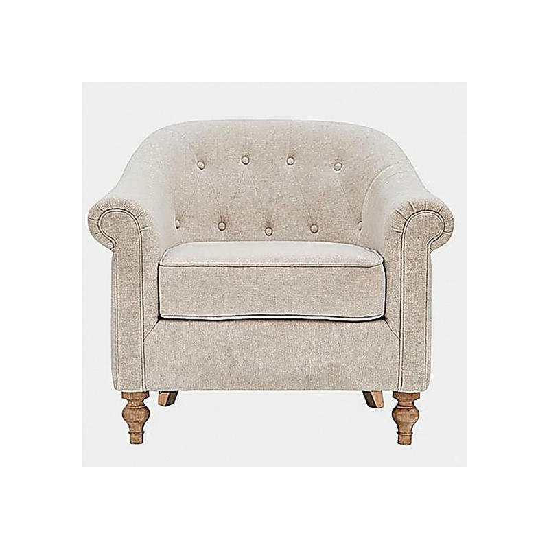 Fauteuil capitonné