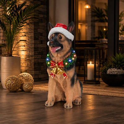 Figurine de chiot berger allemand illuminé avec couronne de Noël et clochettes