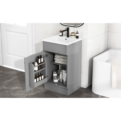 Meuble-lavabo de 18 po avec lavabo. Armoire blanche. Finition de la cuvette à la crasse. Tablette de porte et tablette réglable. Fabrication.