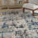 Felty Abstract Cream/Blue Area Rug