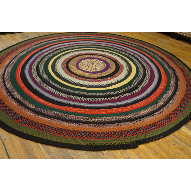 Tapis rond tressé antique à motif circulaire