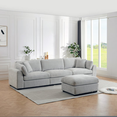 Aariketh 130.87”Wide Upholstered Loose Back Modular Sectional Sofa with Large Ottoman