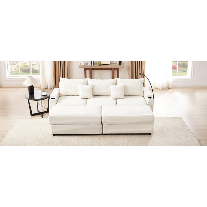 Canapé modulaire beige avec 2 ports, repose-pieds mobile, porte-gobelets, porte-téléphone, compartiments de rangement dissimulés