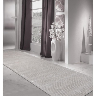 Tapis argenté touffeté à rayures Edgy
