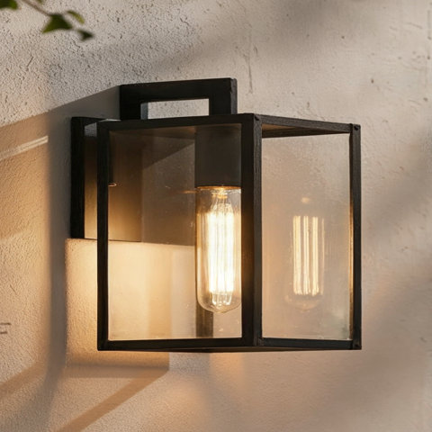 A rectangular metal outdoor wall lantern with a glass enclosure.