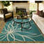 Tapis sarcelle / ivoire touffeté à motif floral Tihiri