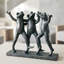 Sculpture trio de grenouilles dansantes