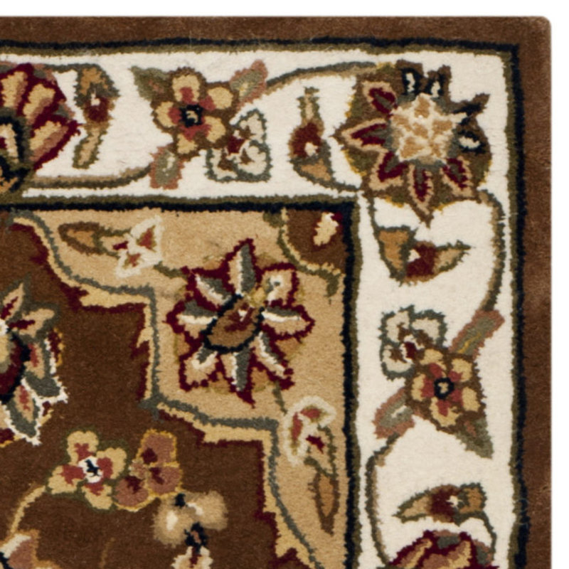 Handmade Tan and Ivory Tufted Wool Round Rug
