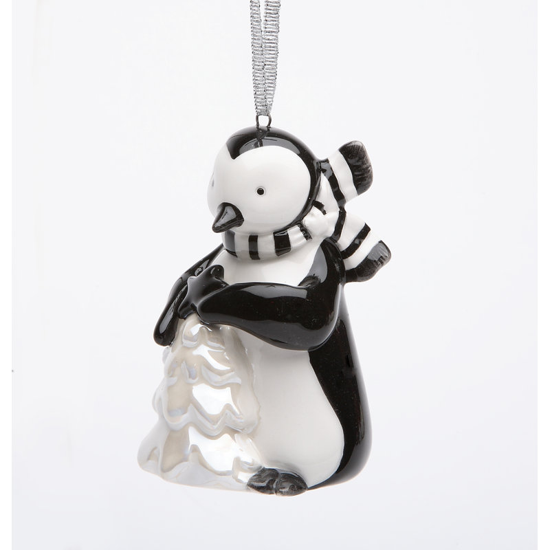 Figurine suspendue pingouin tenant un arbre