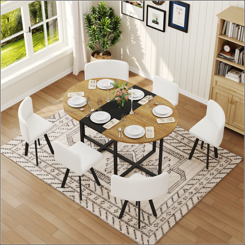 Ensemble de table de salle à manger 7 pièces ovale avec grain de bois fixe et plateau en triamine noire et 6 chaises en similicuir blanc, parfait pour les petits espaces et les cuisines modernes