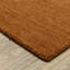 Tapis en laine rouille unie Makhari-1003433150