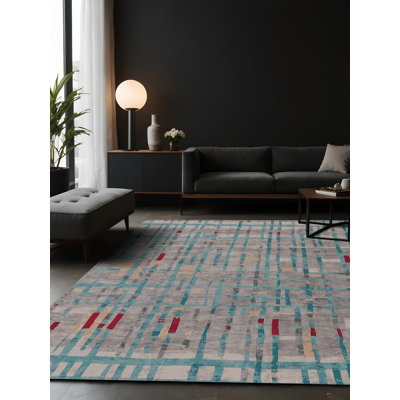 Tapis gris soyeux et moelleux