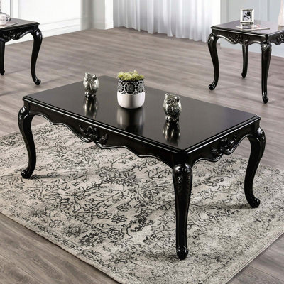 Table basse rectangulaire de style traditionnel avec détails sculptés et pieds en cabriole