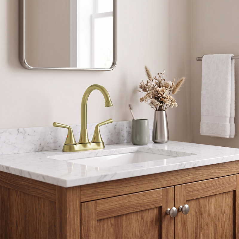 4-inch center-distance double-handle bathroom sink faucet with drain assembly; gold-finish bathroom countertop sink mixer faucet.