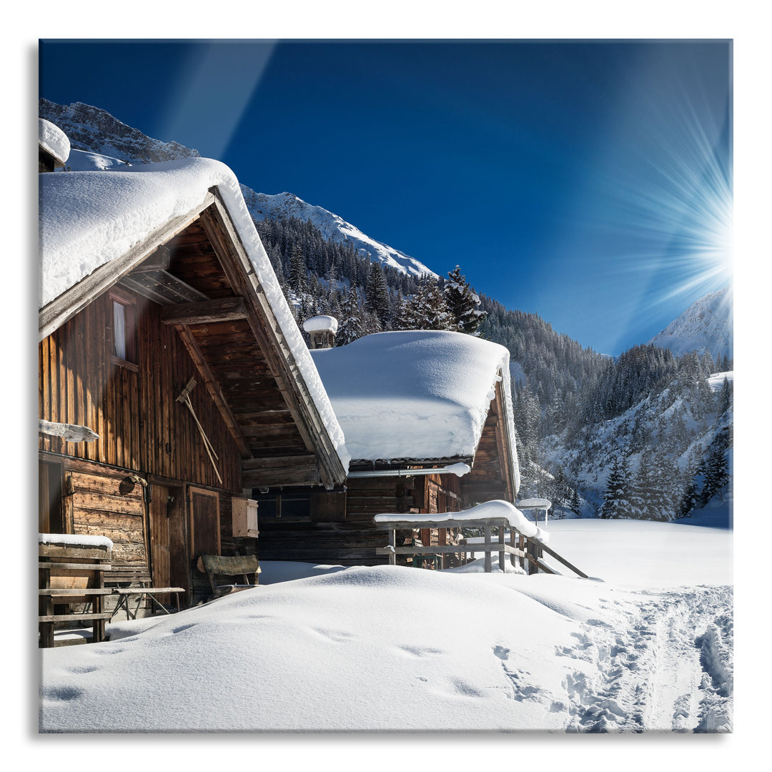 Ungerahmtes Foto auf Glas "Snowy Alpine Huts"