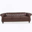 Canapé Chesterfield en polyuréthane à accoudoirs roulés.-114427253