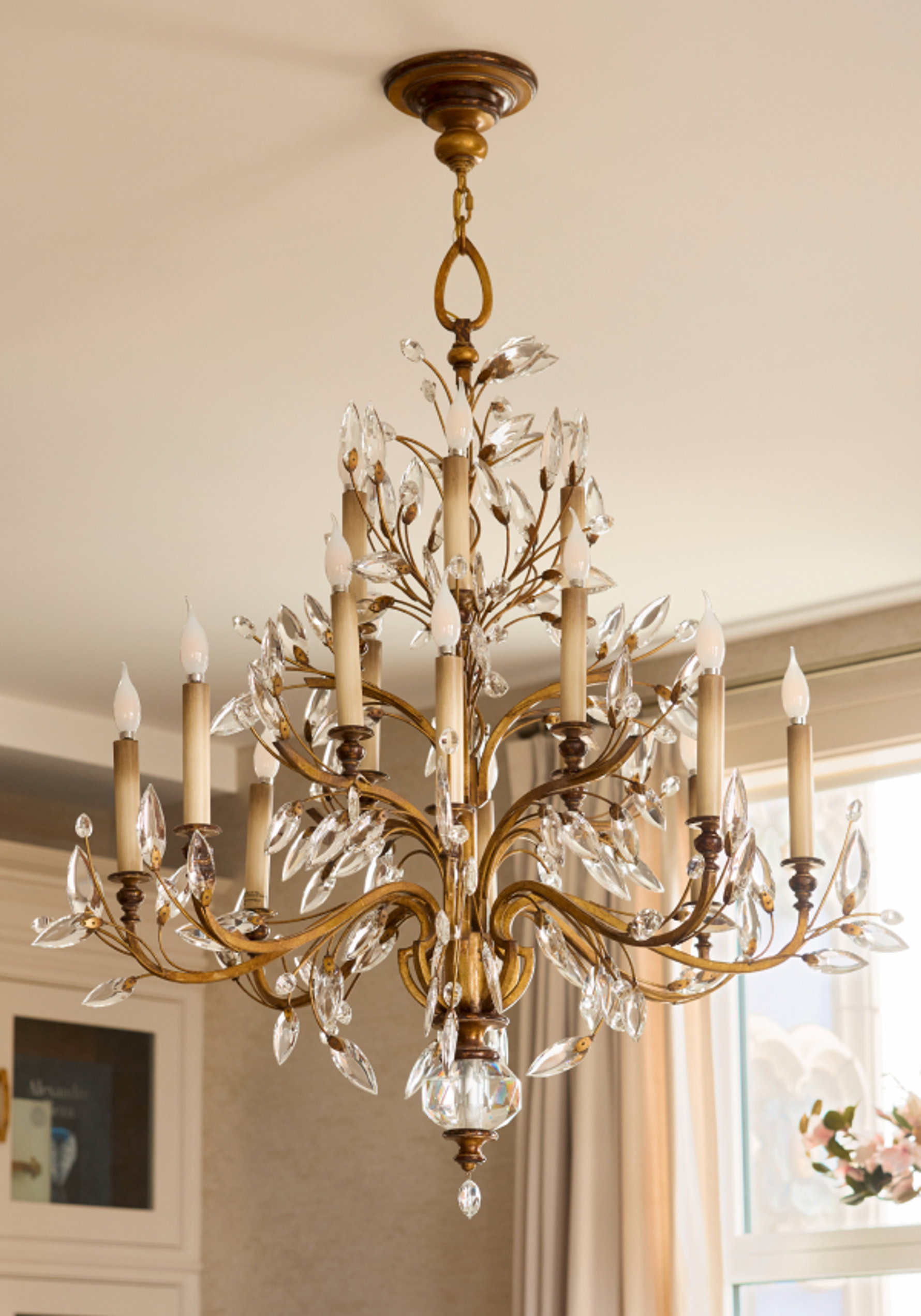 Gold candelabra chandelier with crystal accents.