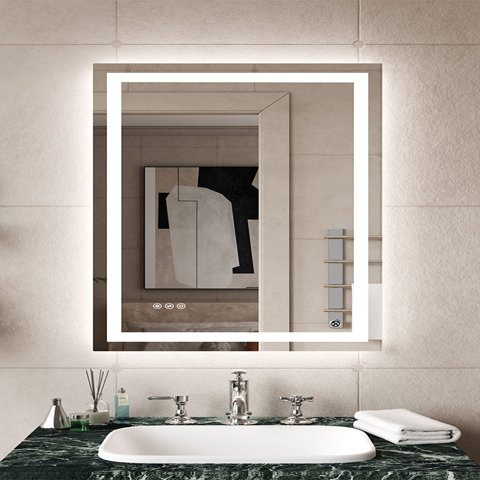 Rectangular wall-mounted bathroom mirror with an integrated LED frame, shown hanging above a green marble vanity with a sink and chrome faucet.
