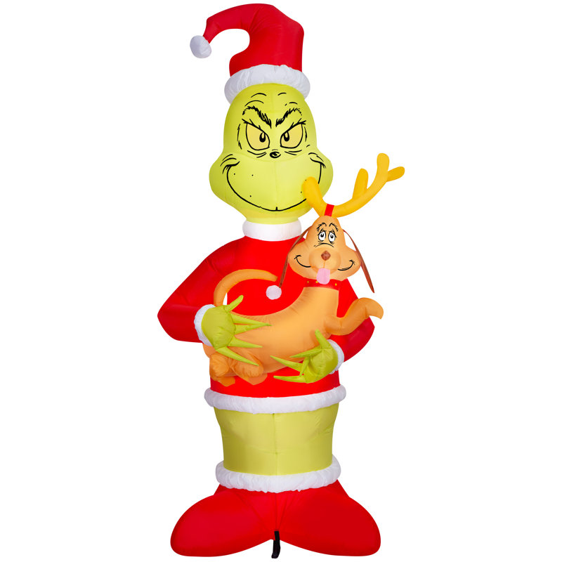 Grinch soufflé à l'air tenant une scène géante du Dr Seuss