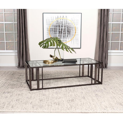 Table basse avec cadre en métal et plateau en verre